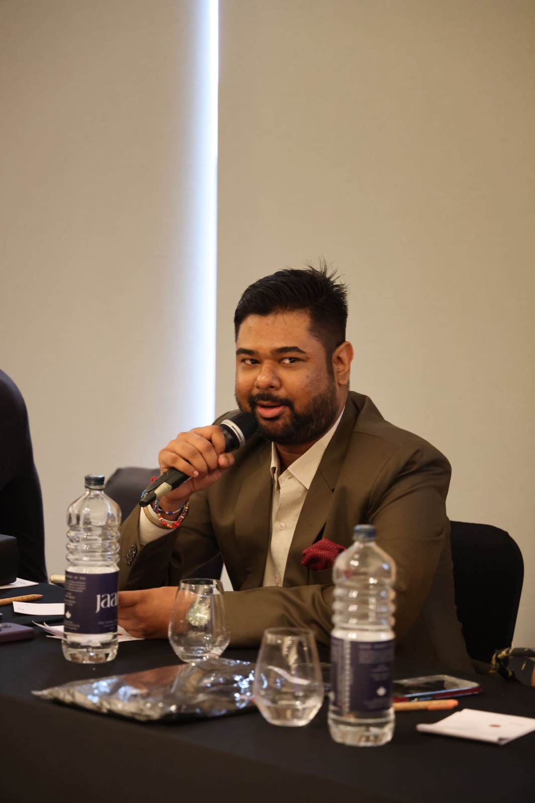 Harshit speaking on a panel